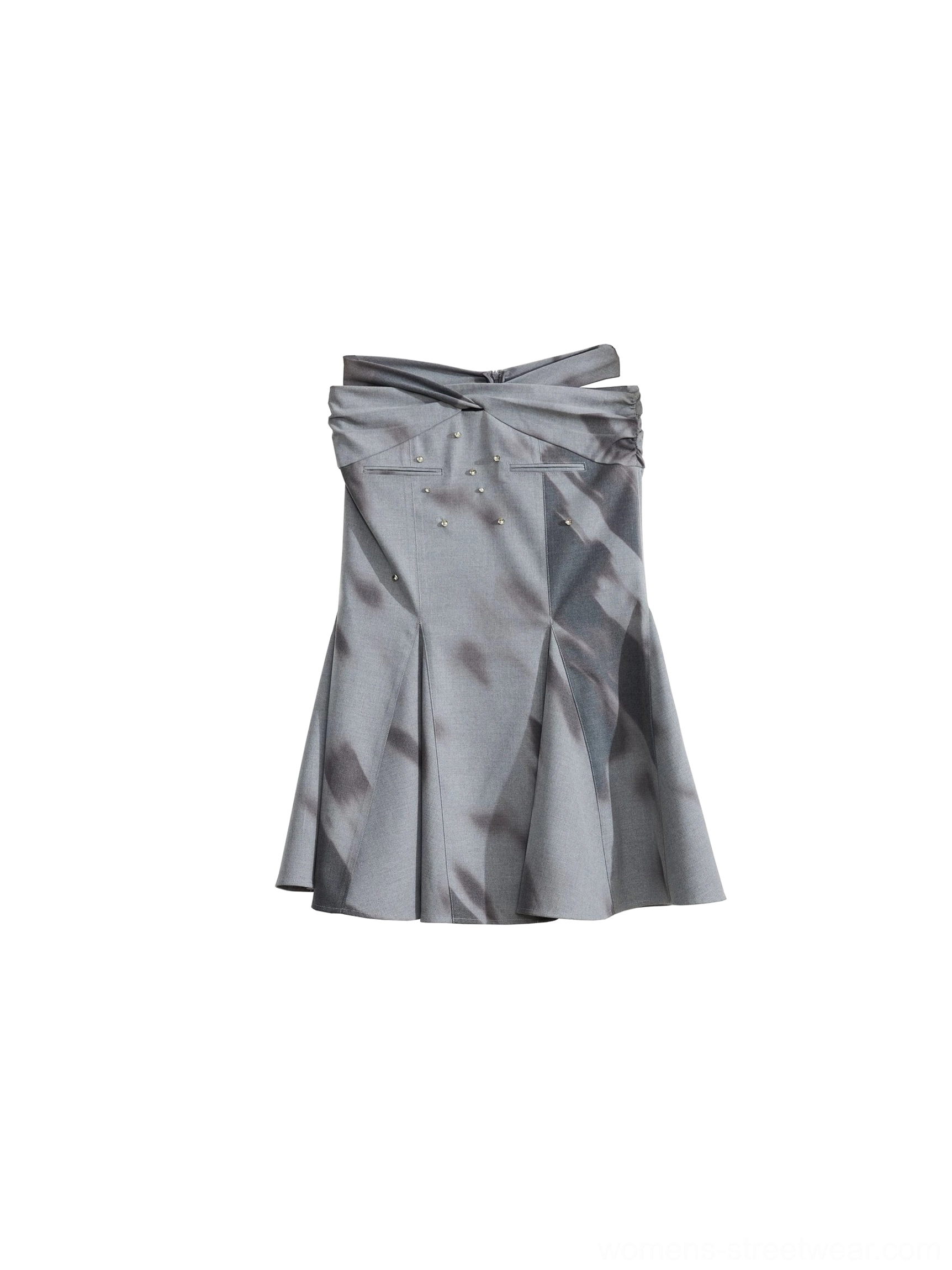 Flat lay of a gray embellished fishtail midi skirt with abstract watercolor print, waistband bow detail, and stud decorations