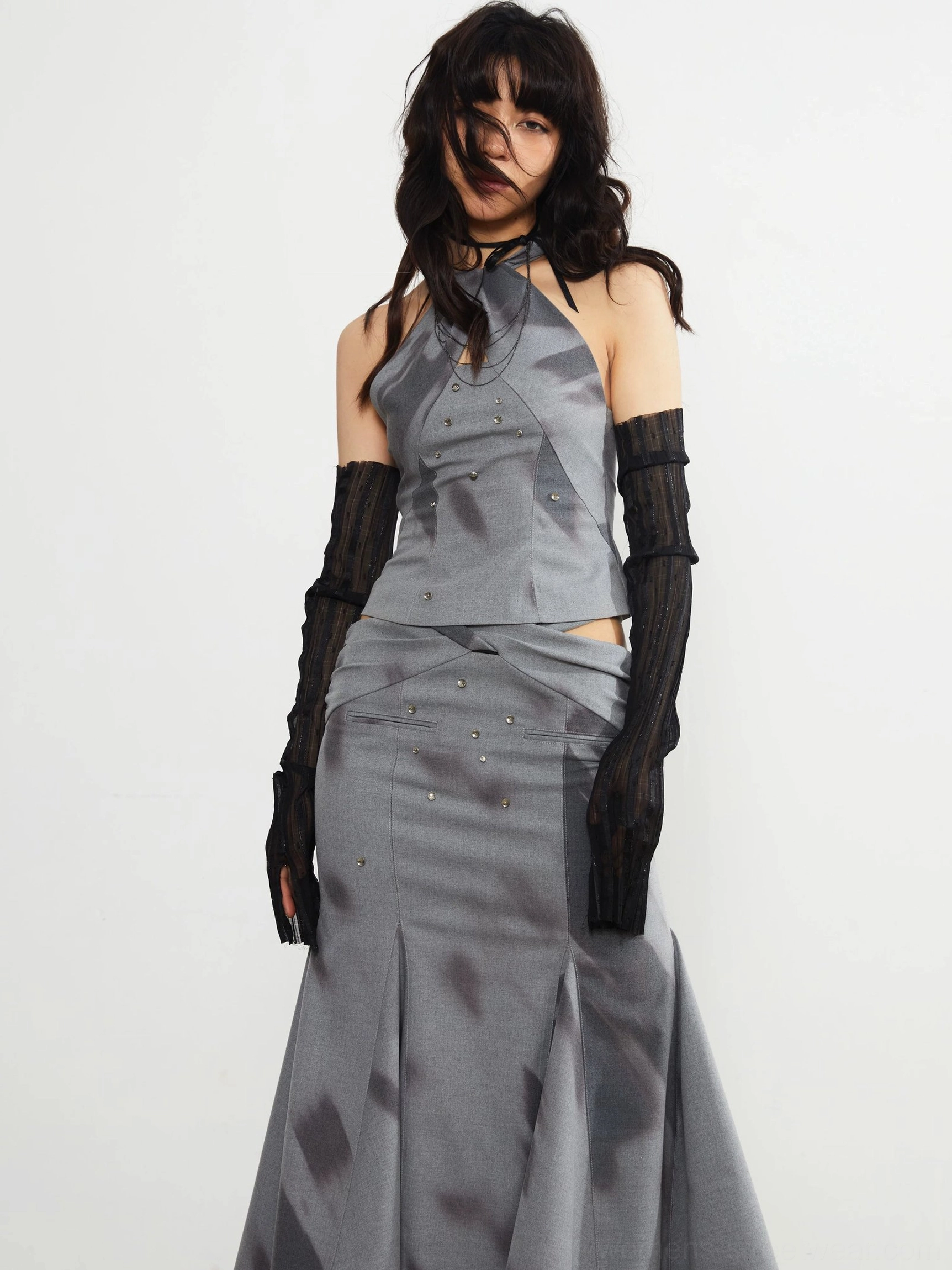 Gray embellished fishtail midi skirt and matching halter top featuring dark abstract print and subtle stud details