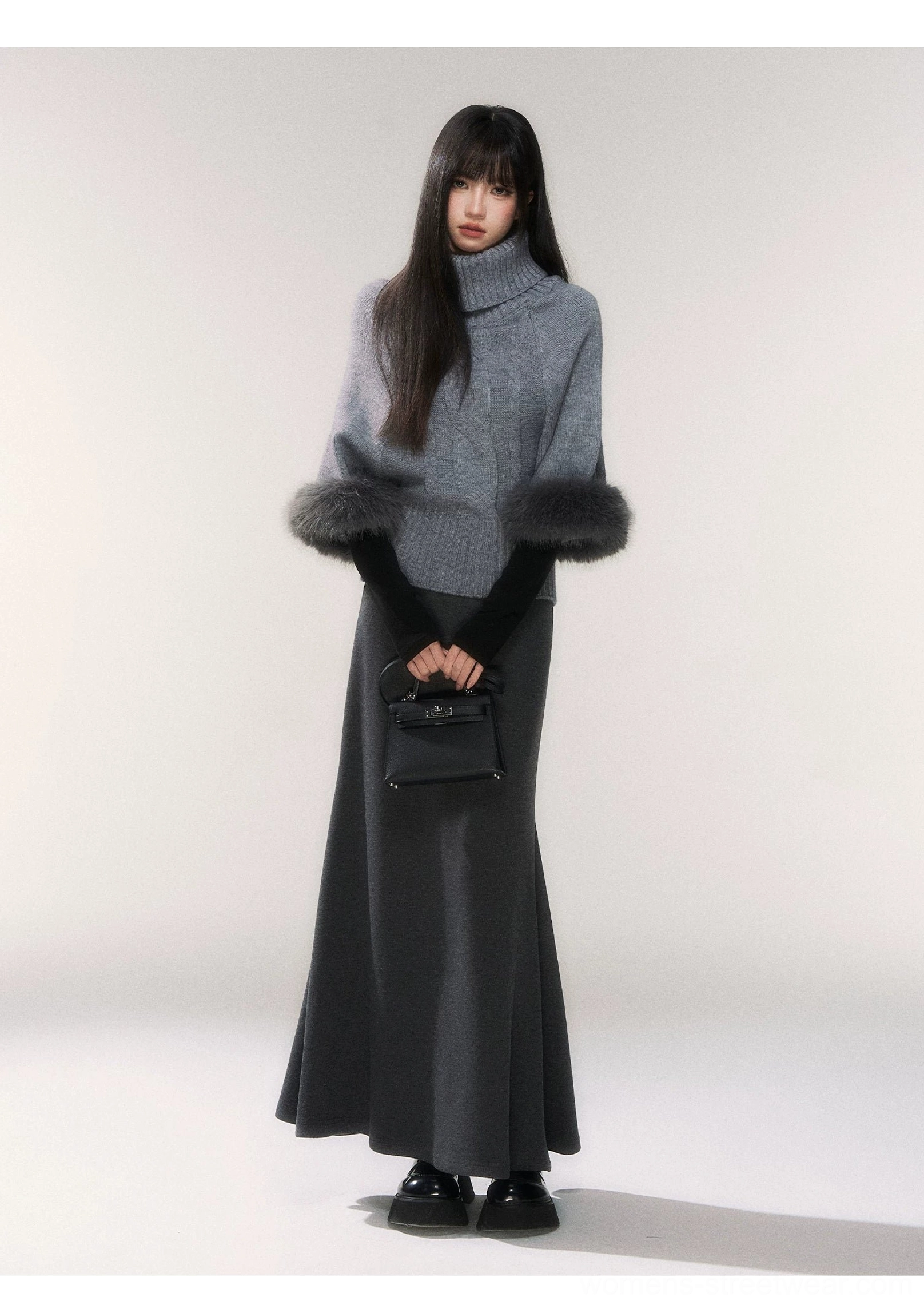 Gray faux fur cuff turtleneck sweater paired with a floor length charcoal maxi skirt in a Korean winter streetwear outfit