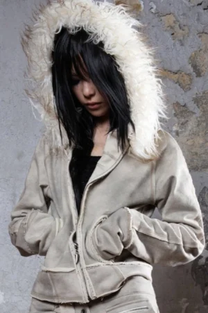Gray faux fur hooded zip jacket three-quarter view showing relaxed fit, partial zipper closure, raw edges, and practical side pockets