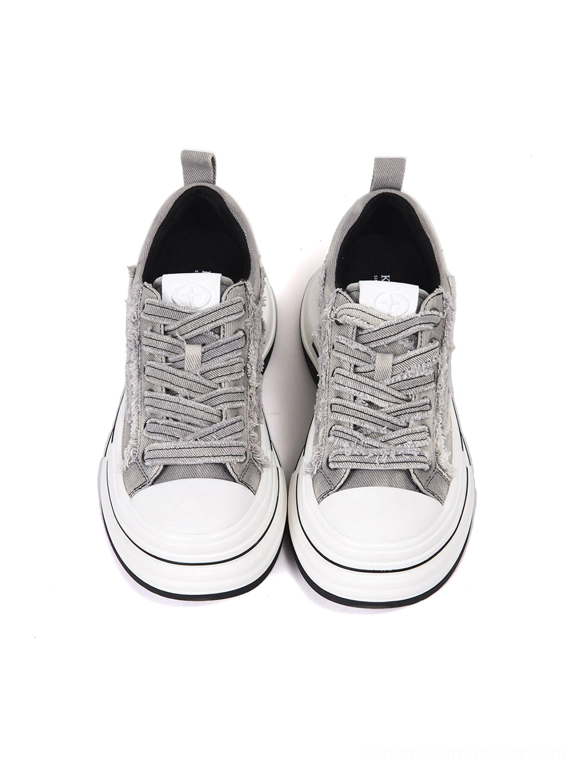 Front top view of paired gray frayed canvas platform sneakers with white round toe caps, textured laces, and clean sole trim