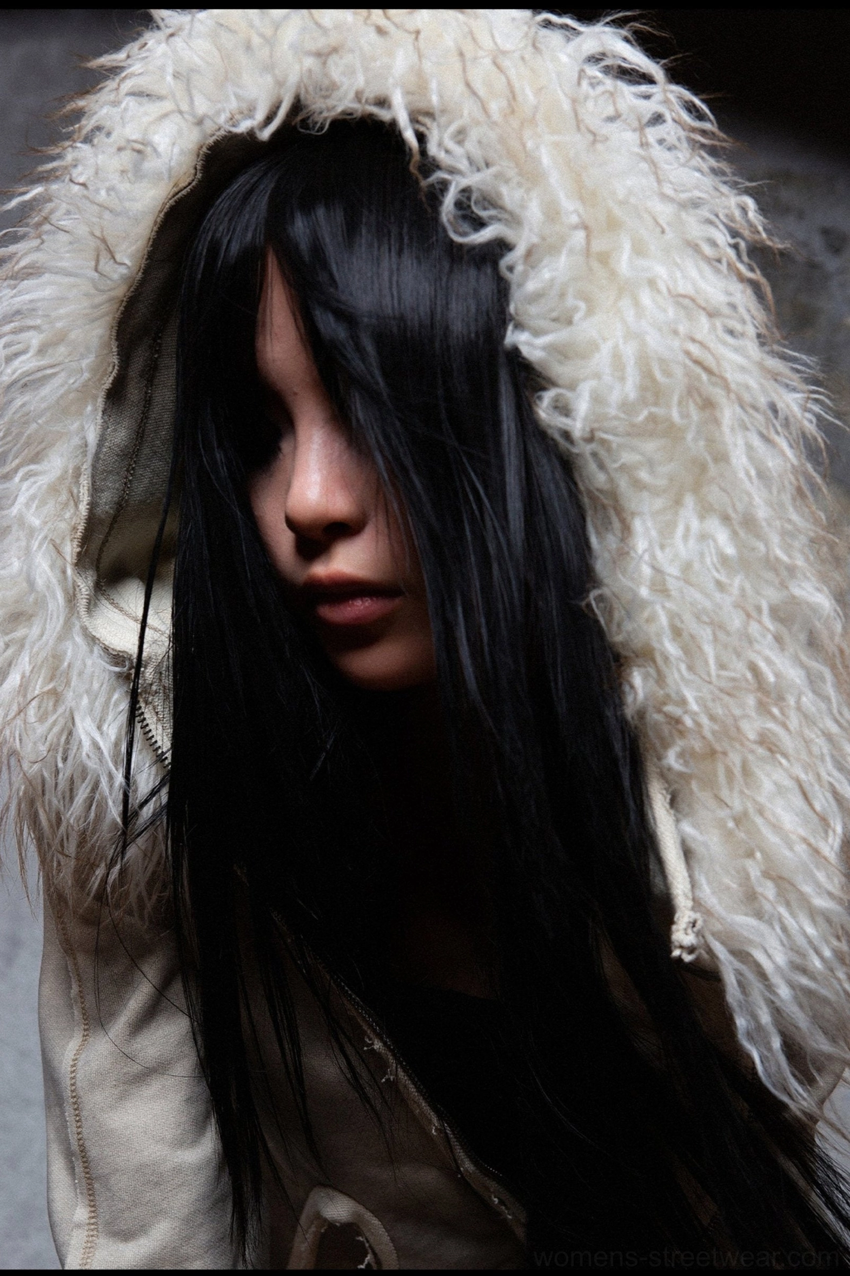 Gray furry hooded jacket with light faux fur trim, relaxed proportions, and modern Y2K-inspired winter streetwear character