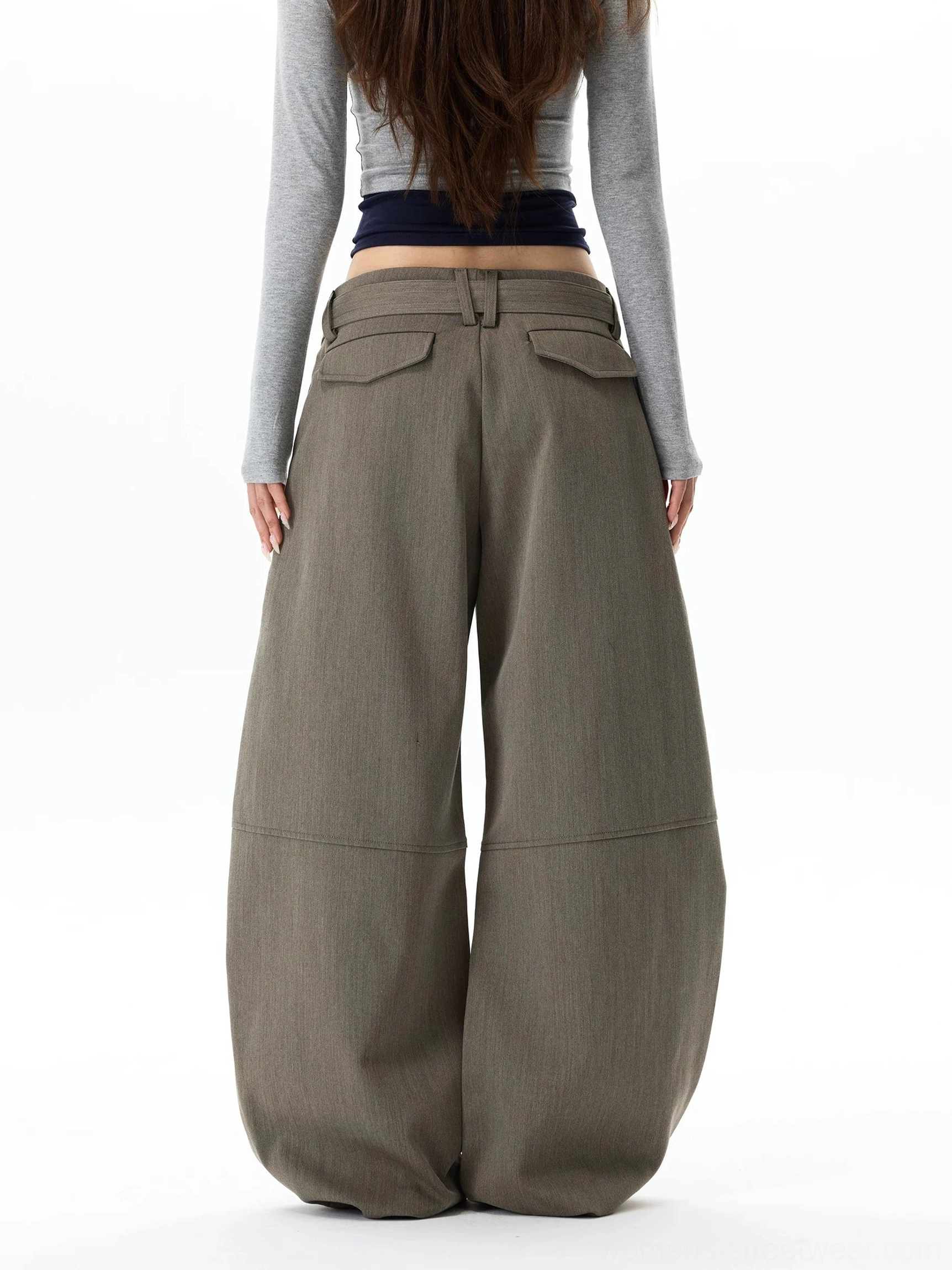 Full rear view of gray khaki streetwear balloon pants featuring rear patch pockets, a clean tailored waistband, and rounded oversized legs