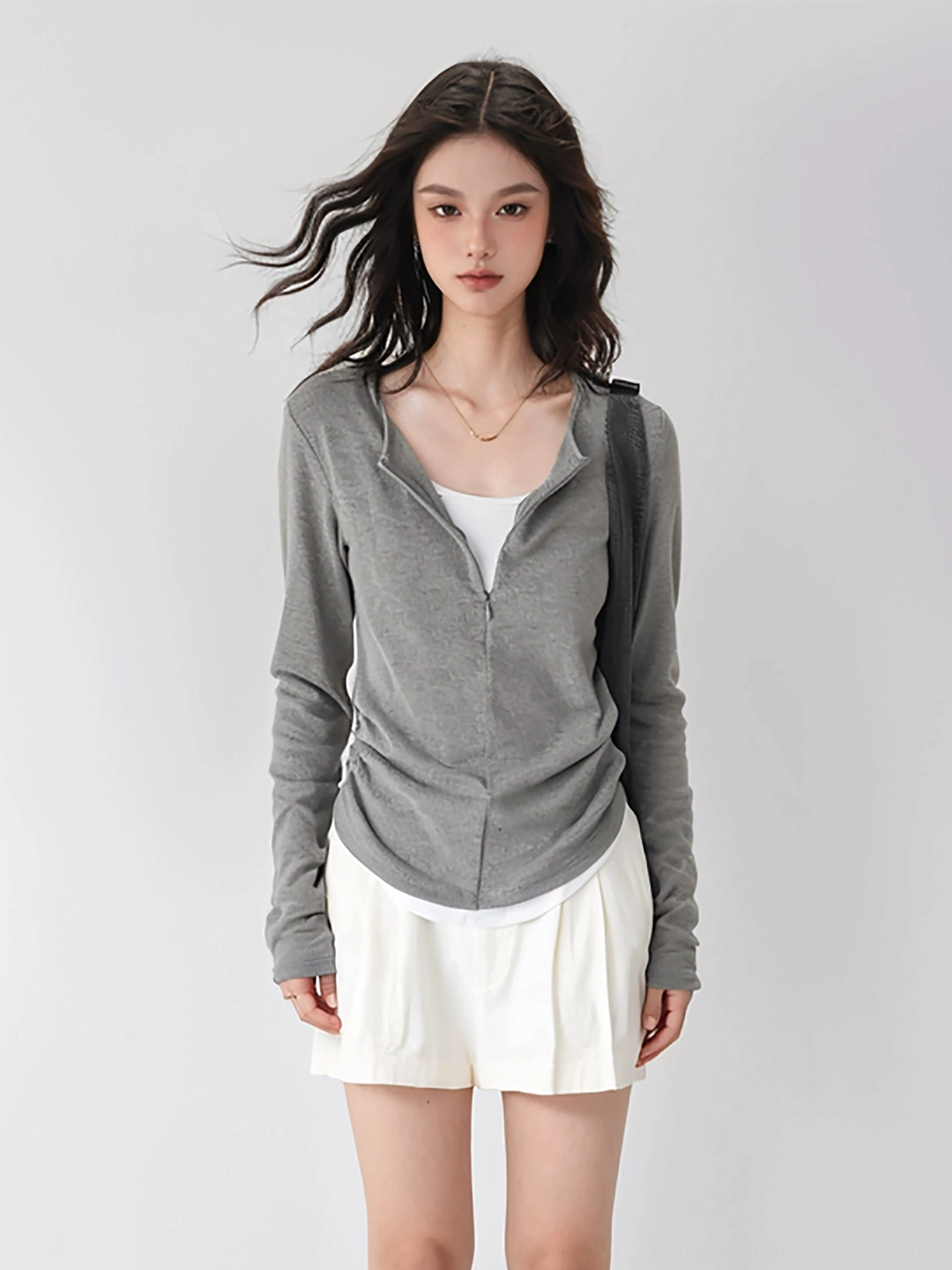 Gray Korean fashion half-zip ribbed knit layered top styled with white mini skirt and black leather tote bag