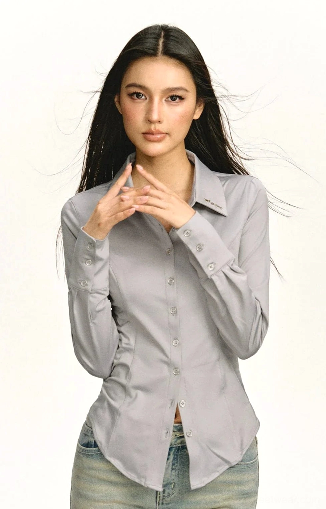 Gray Korean-inspired fitted shirt showing button cuffs and subtle collar detail