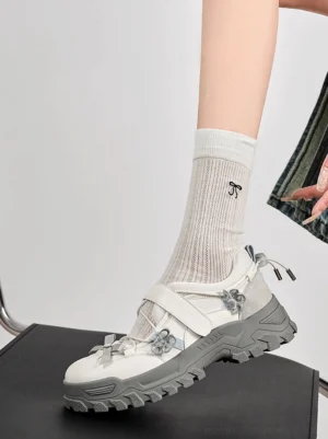 Gray Mary Jane platform sneakers worn with embroidered crew socks and denim in a casual Korean streetwear outfit