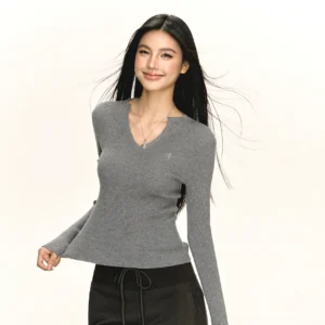 Heather gray notched V-neck ribbed knit long-sleeve top with fitted waist styled with casual drawstring sweatpants