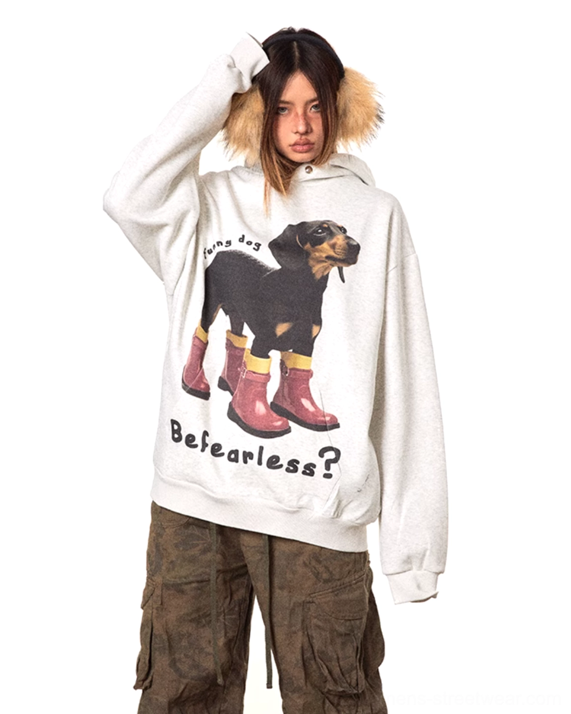 Side three-quarter view of a relaxed oversized dog graphic hoodie with dachshund artwork and fearless slogan in a casual streetwear silhouette