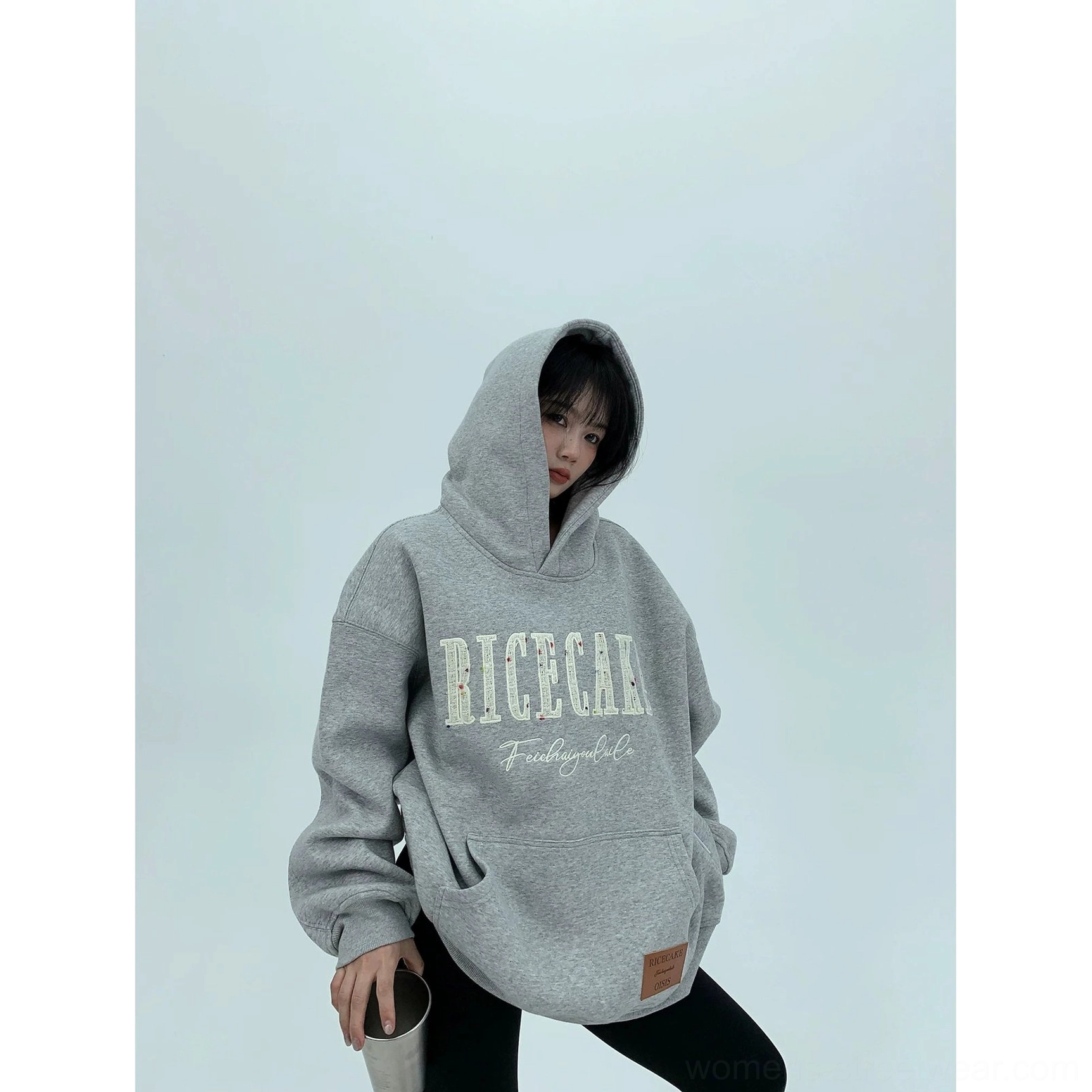 Heather gray oversized fleece hoodie with hood up, large front graphic lettering, relaxed fit, and cozy Korean streetwear aesthetic