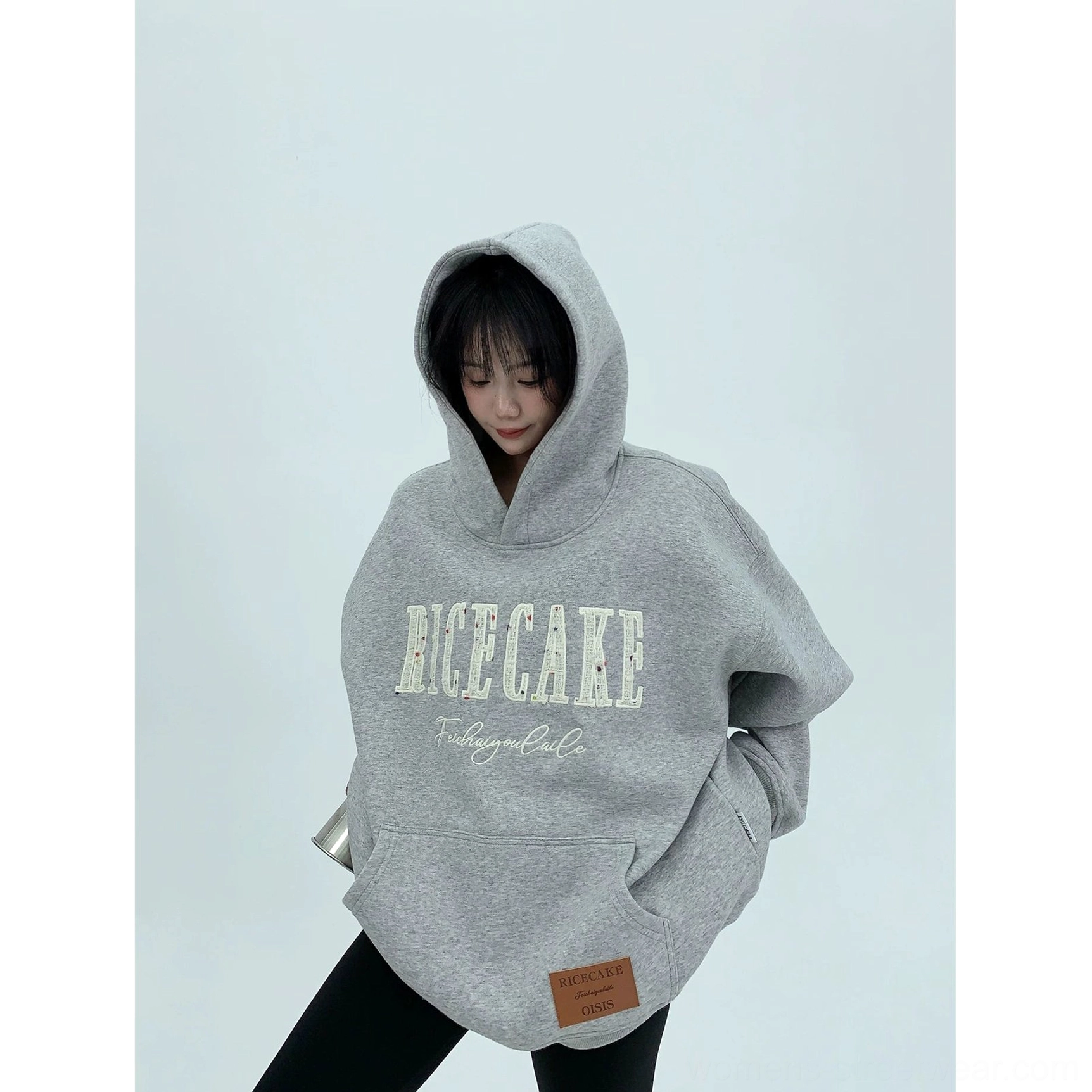 Gray oversized graphic hoodie in heavyweight cotton fleece with roomy hood, kangaroo pocket, and contemporary streetwear fit