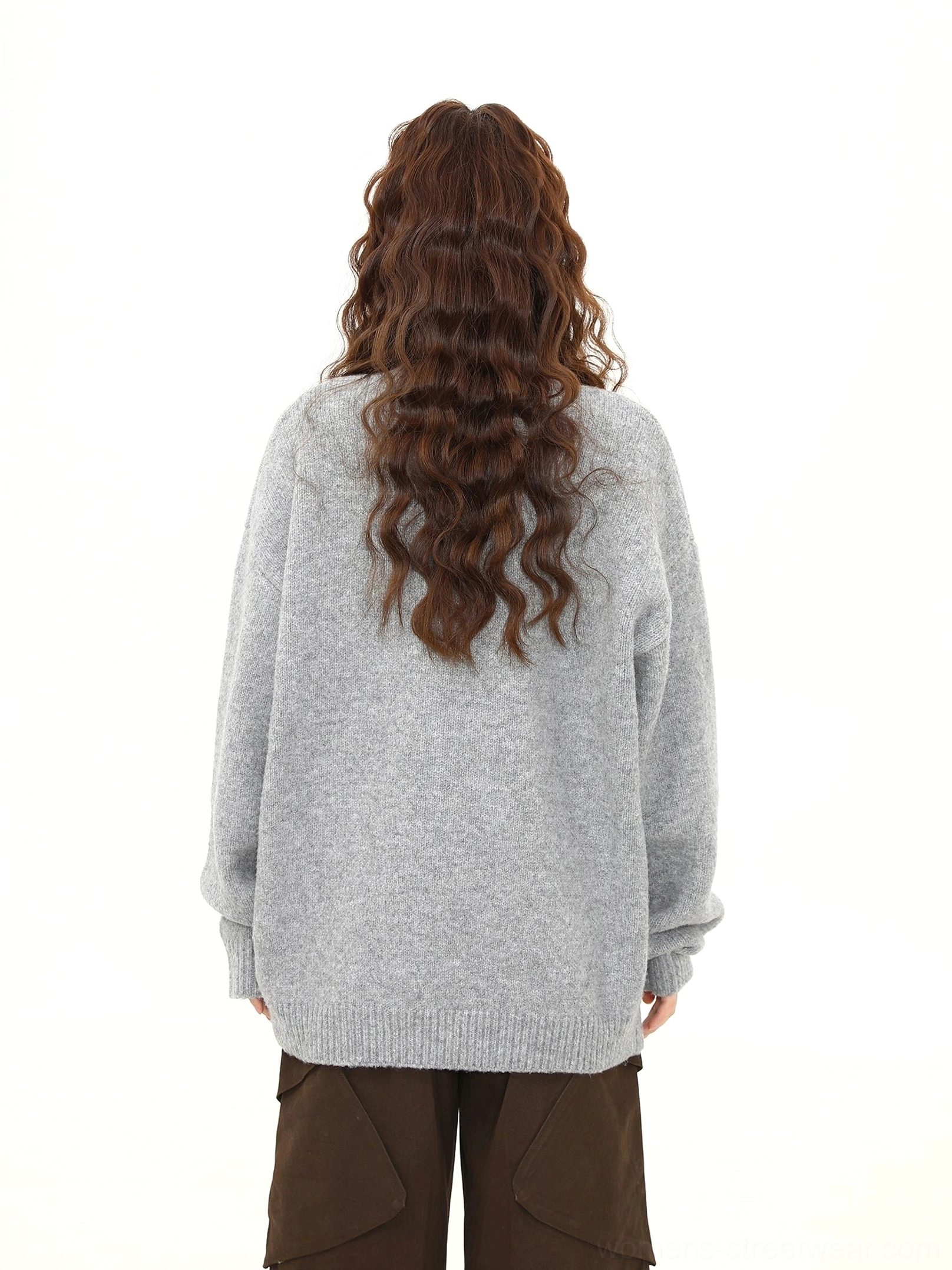 Back view of gray oversized puppy knit sweater showing plain knit back ribbed hem and cuffs