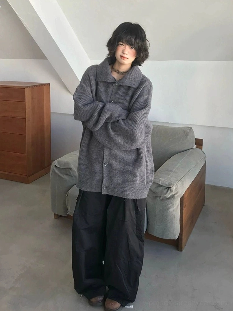 Gray oversized ribbed cardigan sweater with button front styled with wide-leg trousers in a Korean streetwear look