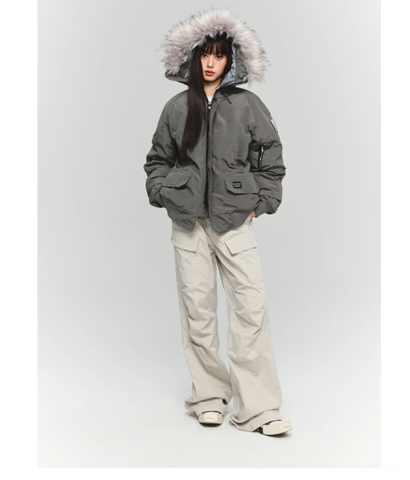 Full-body view of a gray oversized utility winter parka with faux fur hood patch pockets cargo pants and casual sneakers