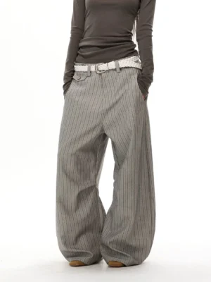 Gray pinstripe wide-leg trousers full front view showing tailored waistband, relaxed fit, and long draped hem