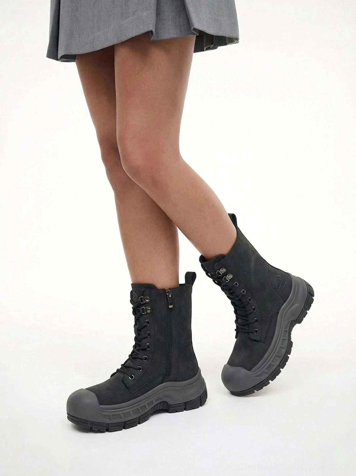Gray platform combat boots fashion footwear detail with molded rugged outsole