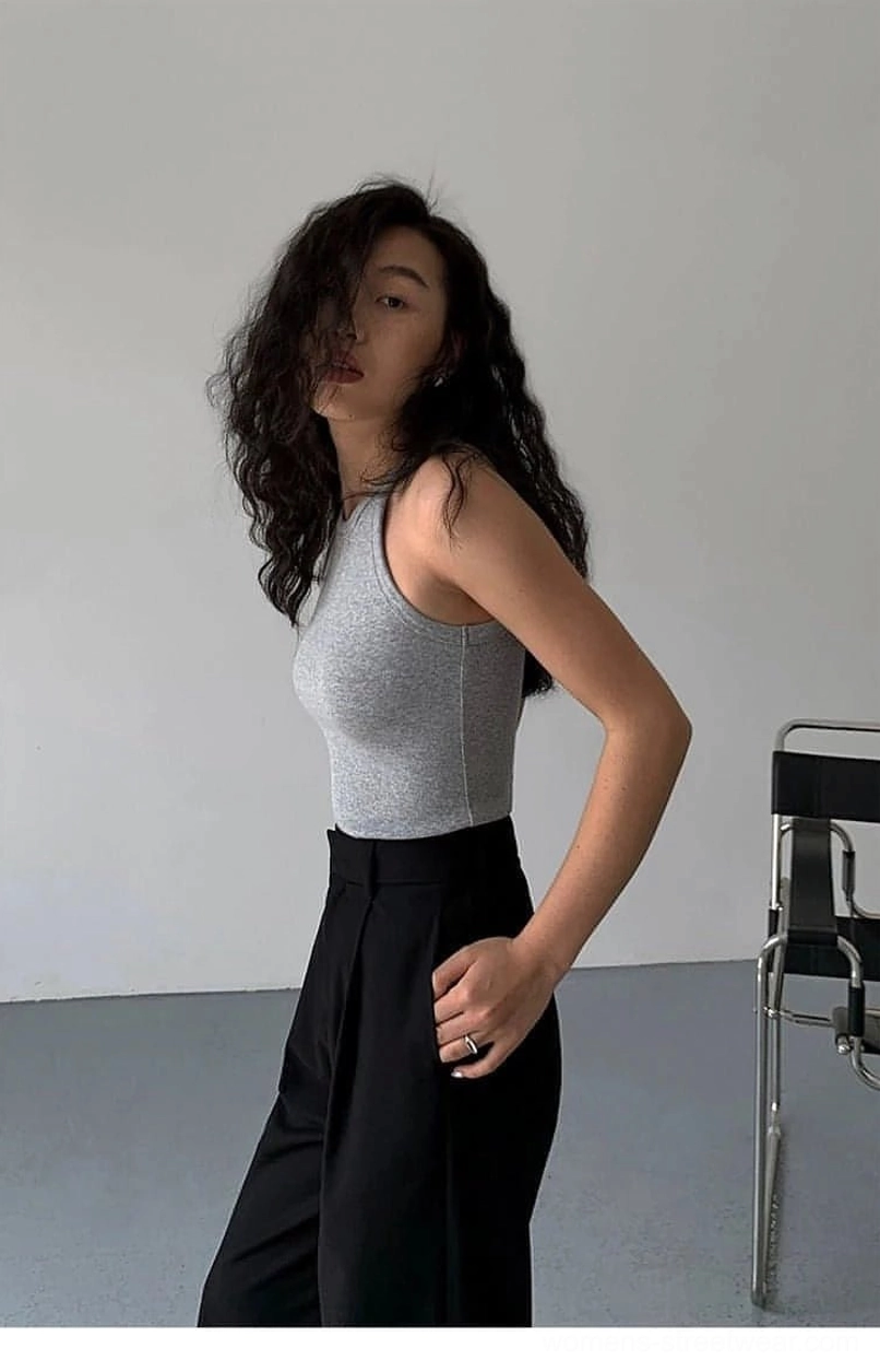 Gray ribbed knit tank top styled with contemporary accessories showing modern streetwear application