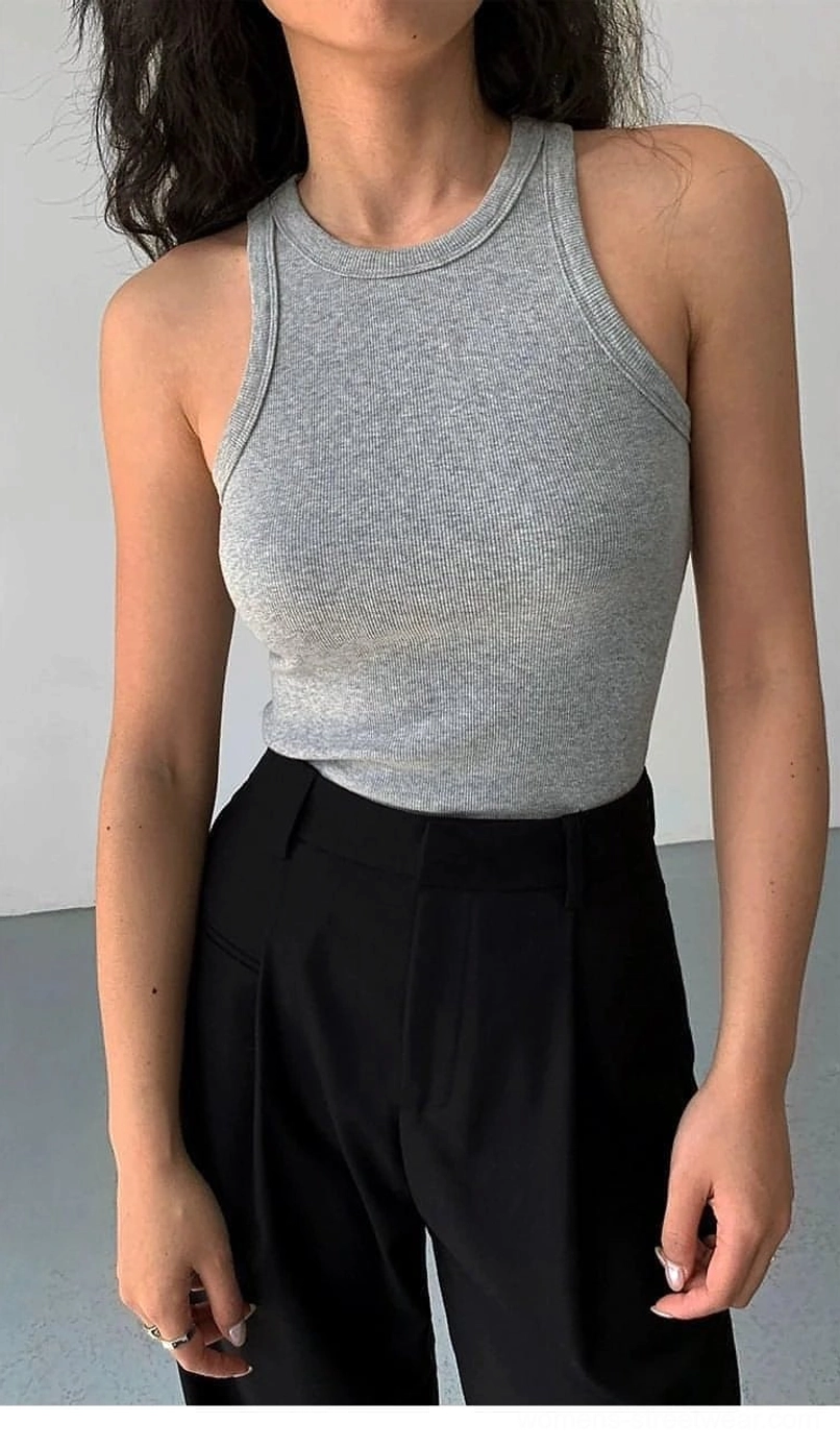Gray ribbed knit tank top as layering base under oversized shirt showcasing building block functionality