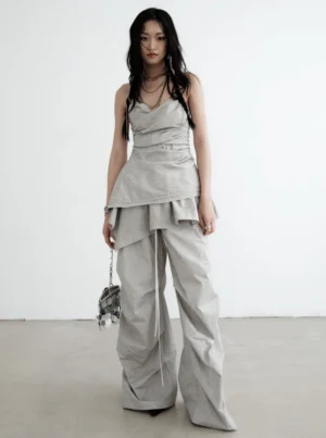 Gray ruffled palazzo cargo pants styled with a ruched camisole and silver handbag in a modern Korean streetwear outfit