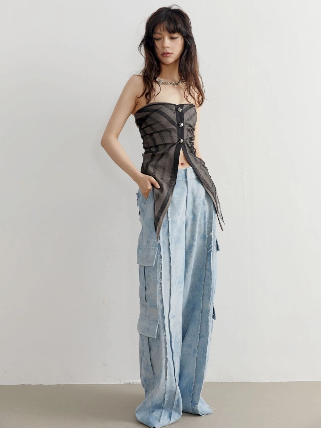 Gray sheer asymmetric studded tube top styled as a contemporary Y2K streetwear outfit