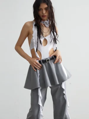 Gray sheer cut-out halter vest styled with ruffle ribbons and wide-leg trousers in an avant-garde streetwear outfit