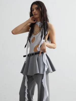 Side view of gray sheer halter vest with front cut-outs and flowing ruffle ribbon details in Seoul streetwear styling