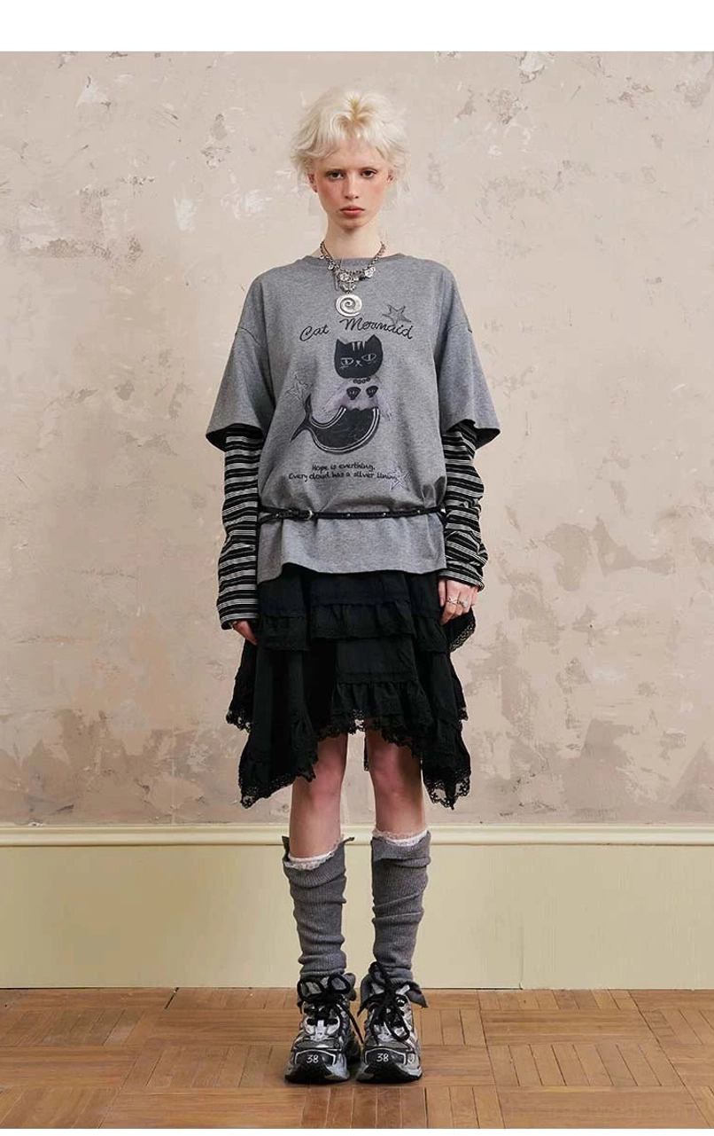 Gray sporty hooded windbreaker jacket and flowing lace midi skirt set with adjustable drawstring details for contemporary Acubi streetwear