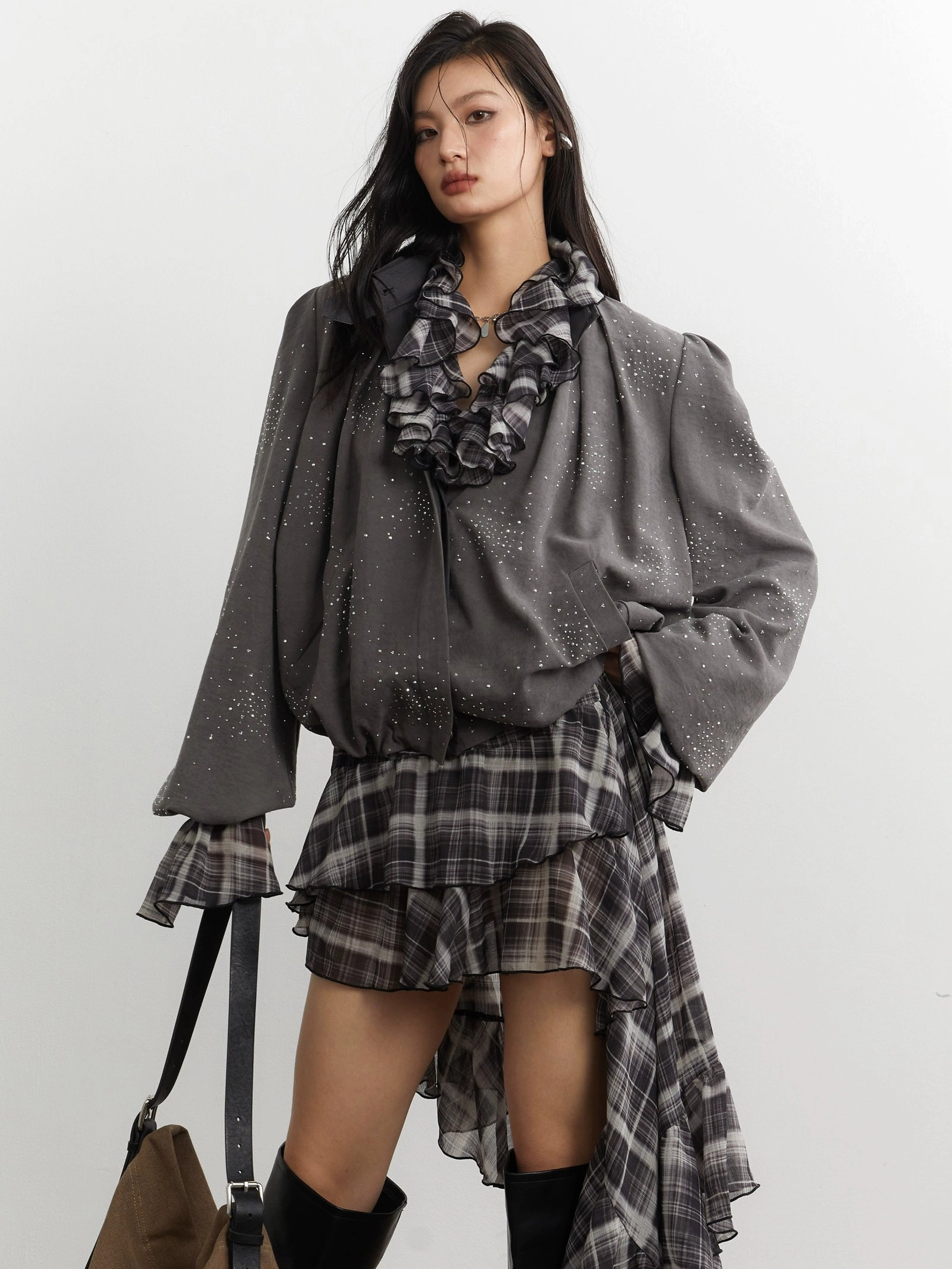 Close front view of gray stardust cropped jacket showing balloon sleeves gathered cuffs stand collar and subtle glitter speckle fabric