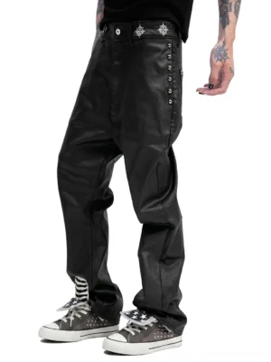 Male model wearing gray studded high-top streetwear sneakers with black coated leather pants and punk-inspired silver hardware details