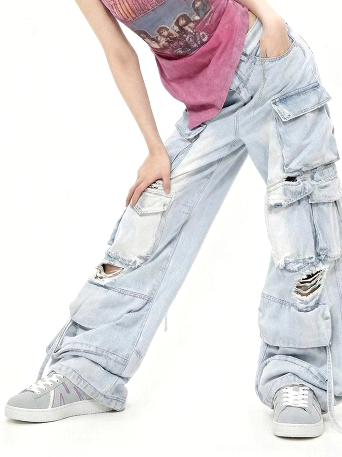 Gray suede platform skate sneakers with subtle purple accents styled with vintage tank top and cargo jeans