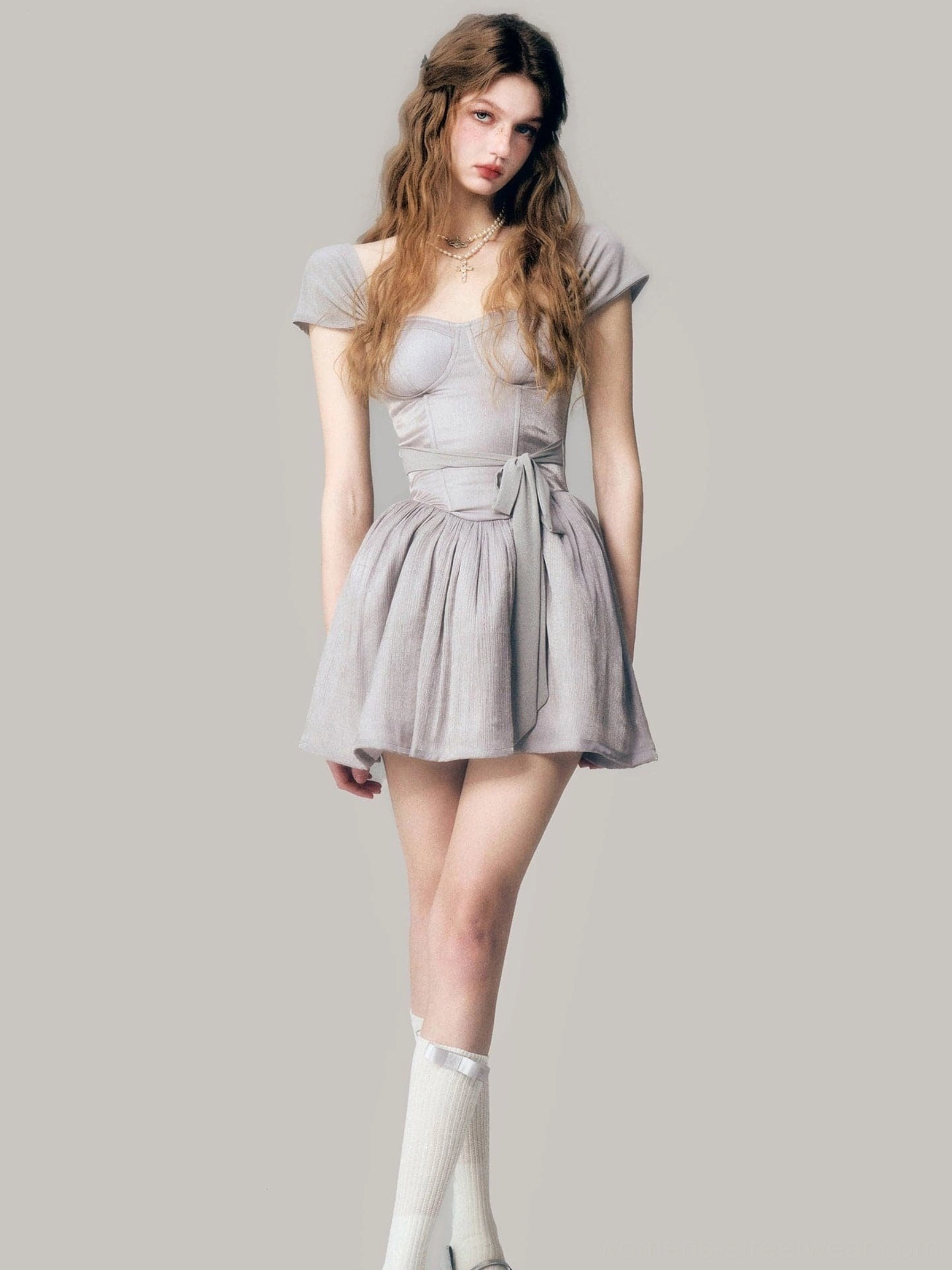 Front view of a gray sweetheart neckline corset mini dress with short cap sleeves and flared tutu skirt
