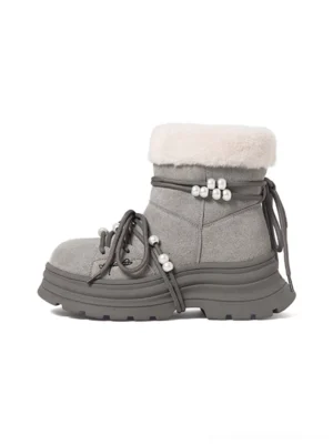 Gray teddy bear plush cuff platform snow boot in left three-quarter studio view with rope laces pearl accents and chunky lug sole