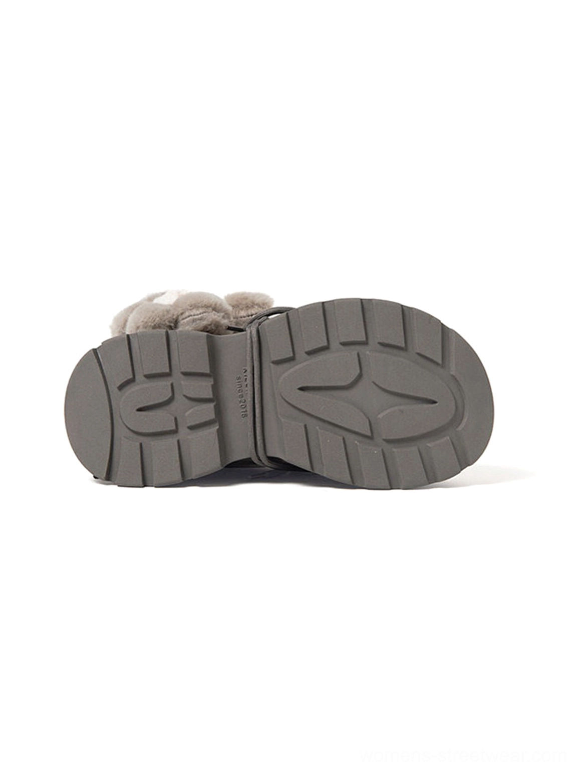 Deep multi-directional lug outsole of gray teddy bear plush cuff platform snow boot shown in studio detail view
