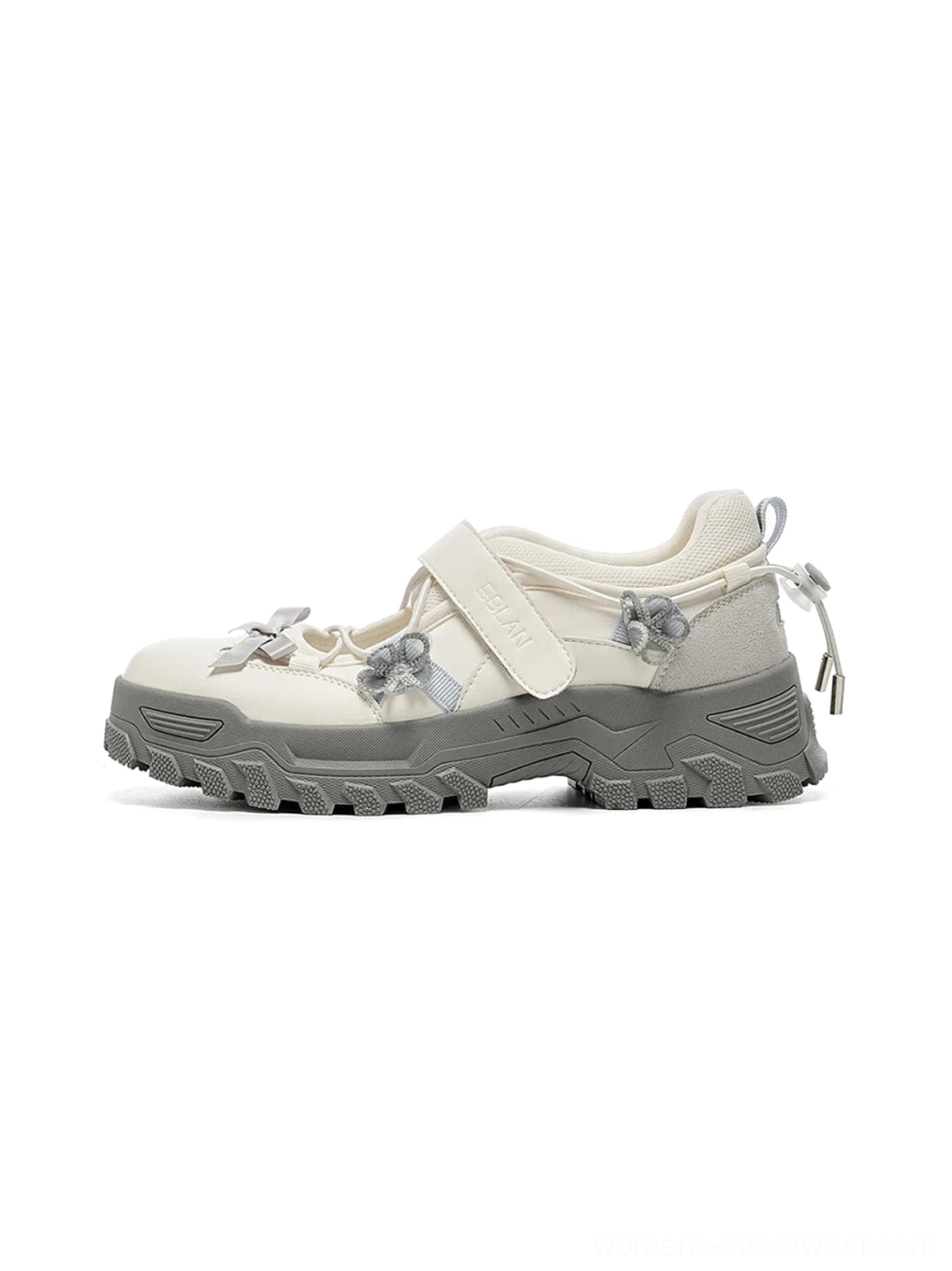 Gray and white Mary Jane platform sneakers with Velcro strap bow details chunky textured outsole and streetwear styling