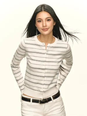 Grayish white striped button front knit henley cardigan close up showing ribbed round neckline and hem