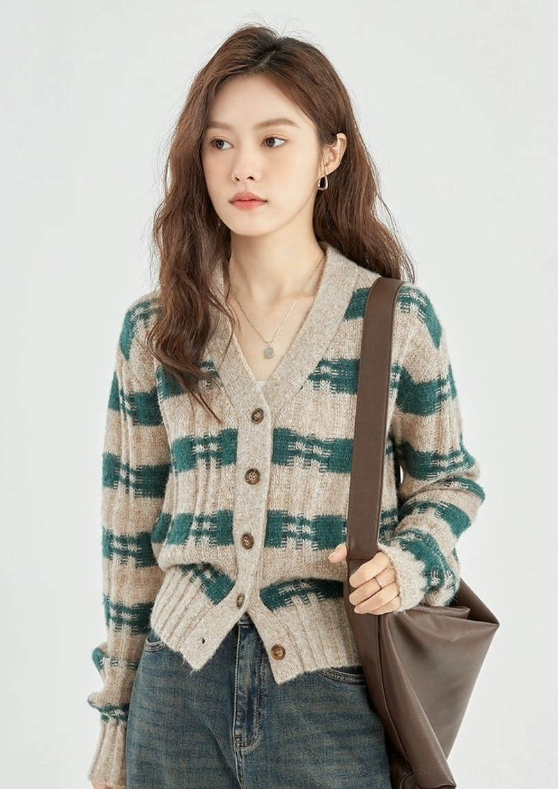 Close up of green beige plaid cropped knit cardigan showing V neckline buttons ribbed trim and knit texture