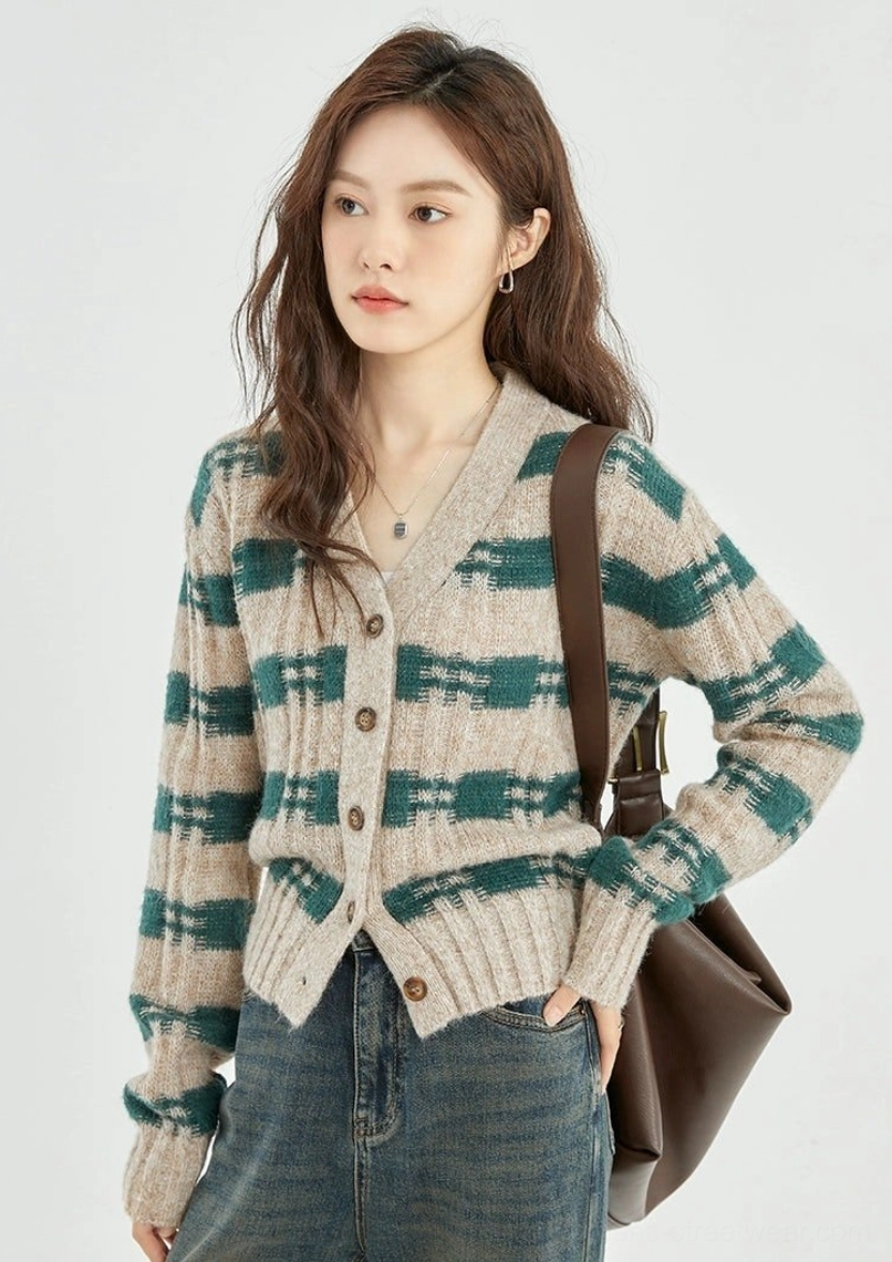 Left side view of green beige plaid cropped knit cardigan with long sleeves and ribbed cuffs