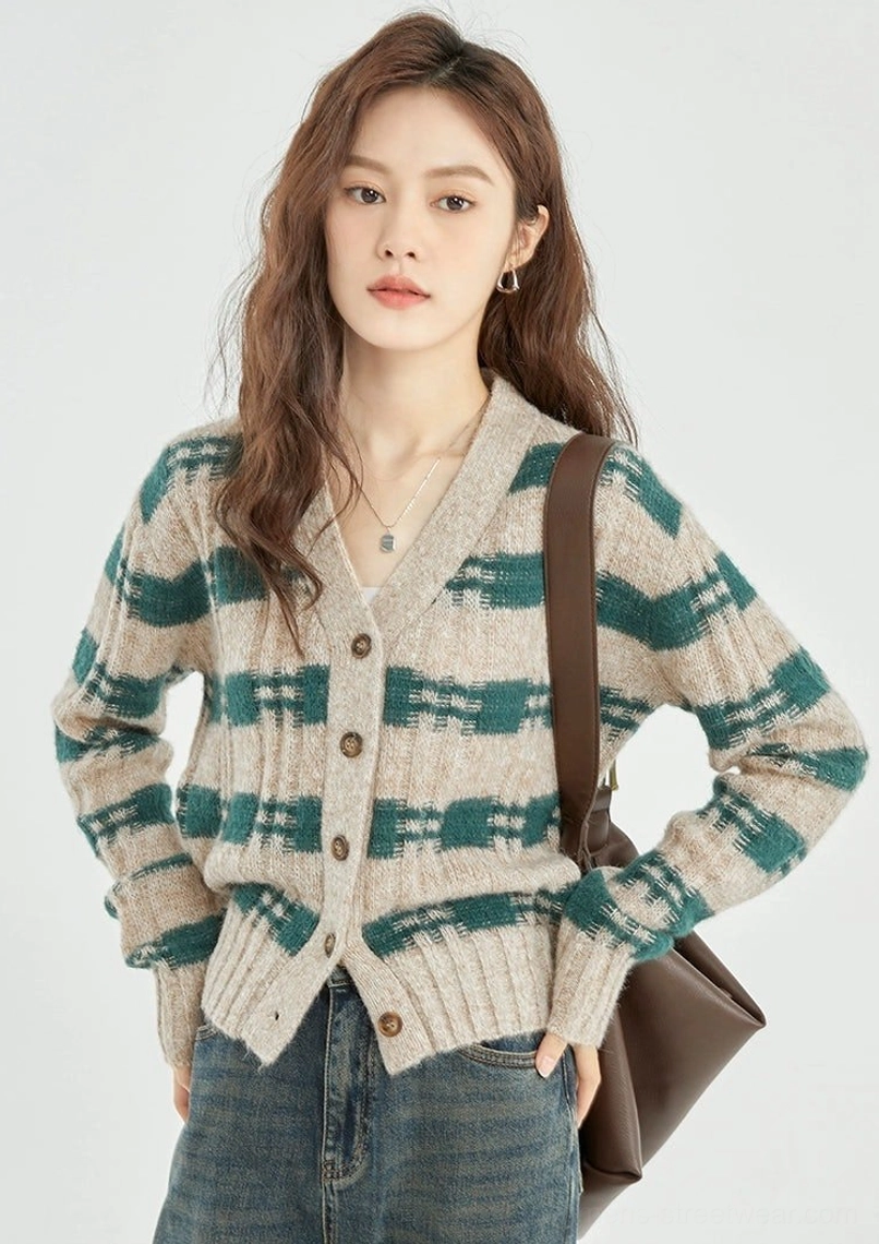 Right side view of green beige plaid cropped knit cardigan showing cropped ribbed hem and button closure