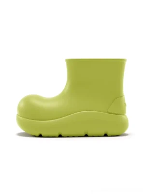 Green chunky short rain boot in matcha lime with rounded toe elevated platform sole and smooth matte upper shown in side profile