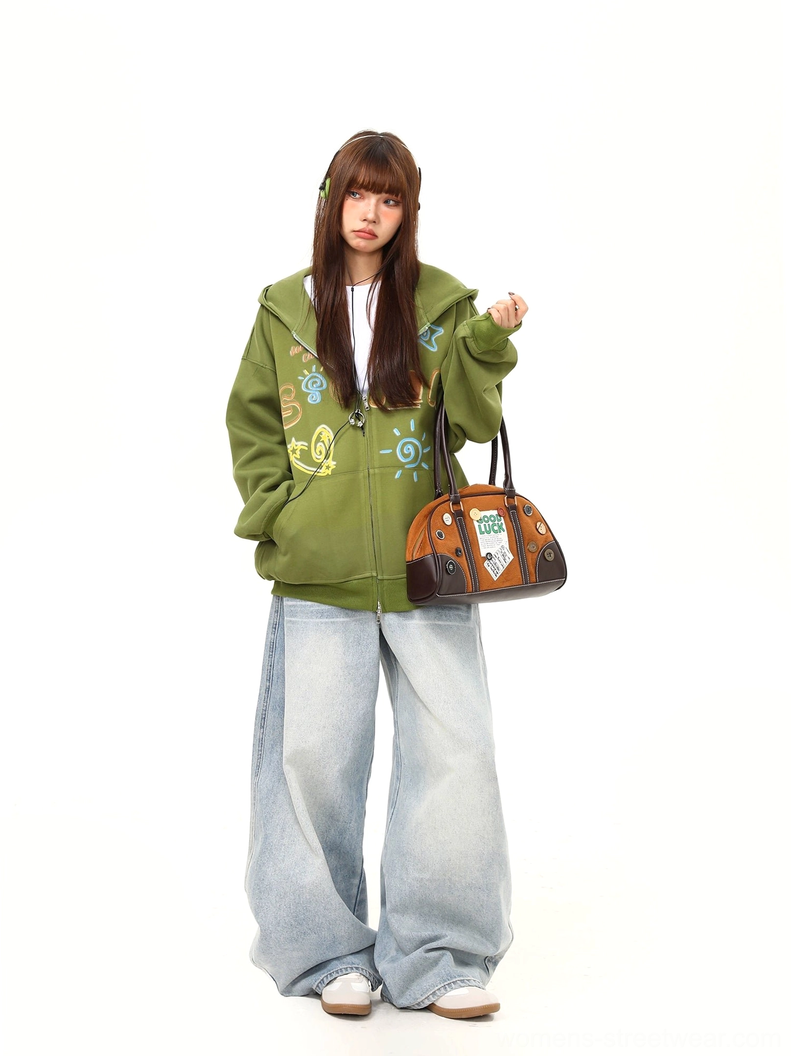Green doodle graphic zip-up hoodie styled with wide-leg jeans and a vintage handbag in a relaxed Seoul street fashion outfit