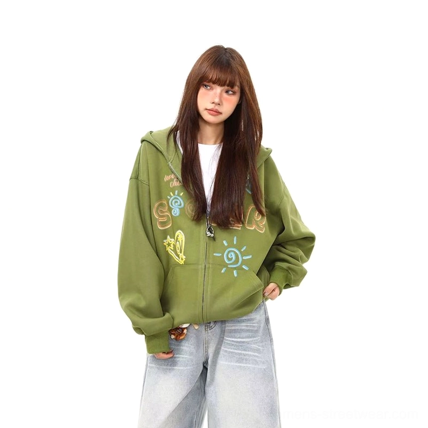 Front view of a green doodle print zip-up hoodie with oversized silhouette, kangaroo pocket, full zipper, and colorful graphic details