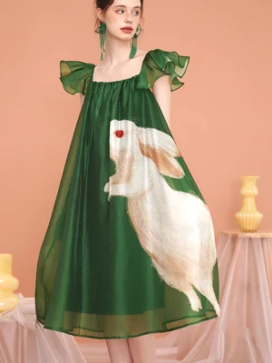 Green enchanted forest rabbit print midi dress with square neckline, flutter sleeves, sheer organza texture, and flowing full skirt