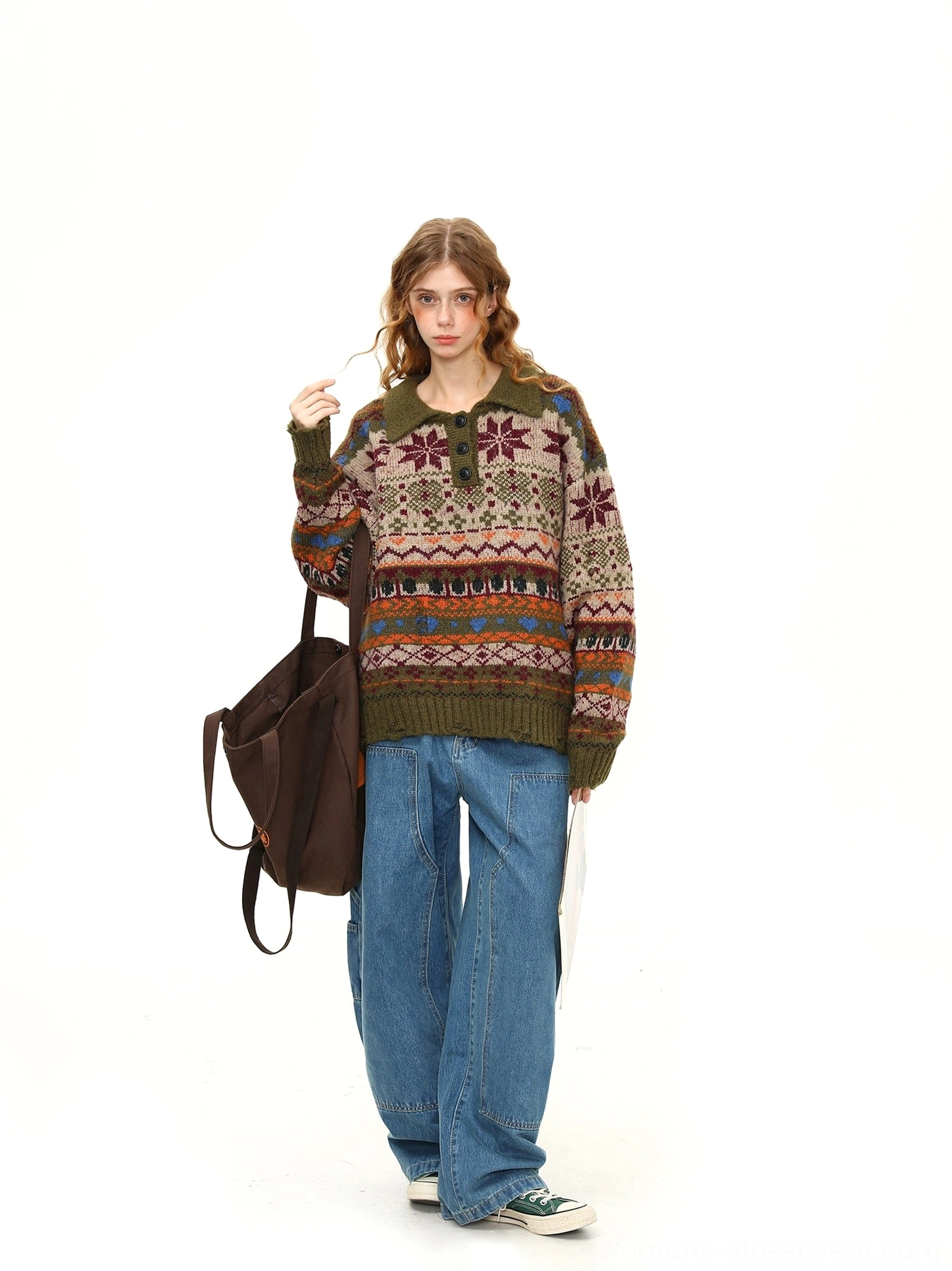 Right side full view of a relaxed green Fair Isle knit polo sweater with vintage jacquard pattern styled with wide-leg jeans and a backpack