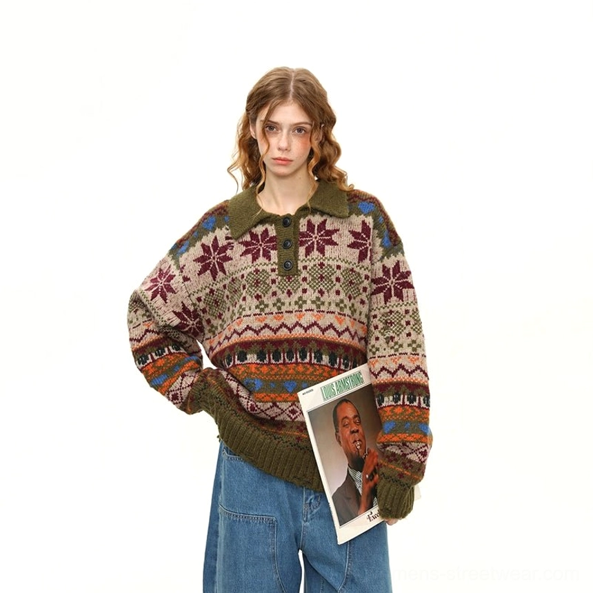 Three-quarter front view of a green Fair Isle polo sweater with retro snowflake stripe print, olive ribbed trims, and oversized fit styled with wide-leg blue jeans
