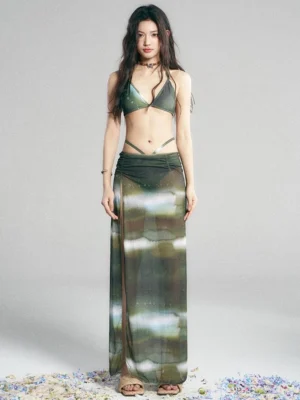 Green galaxy print swimwear set with matching full length sheer maxi skirt and three piece Y2K beachwear styling