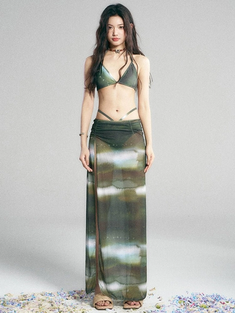 Green galaxy print swimwear set with matching full length sheer maxi skirt and three piece Y2K beachwear styling