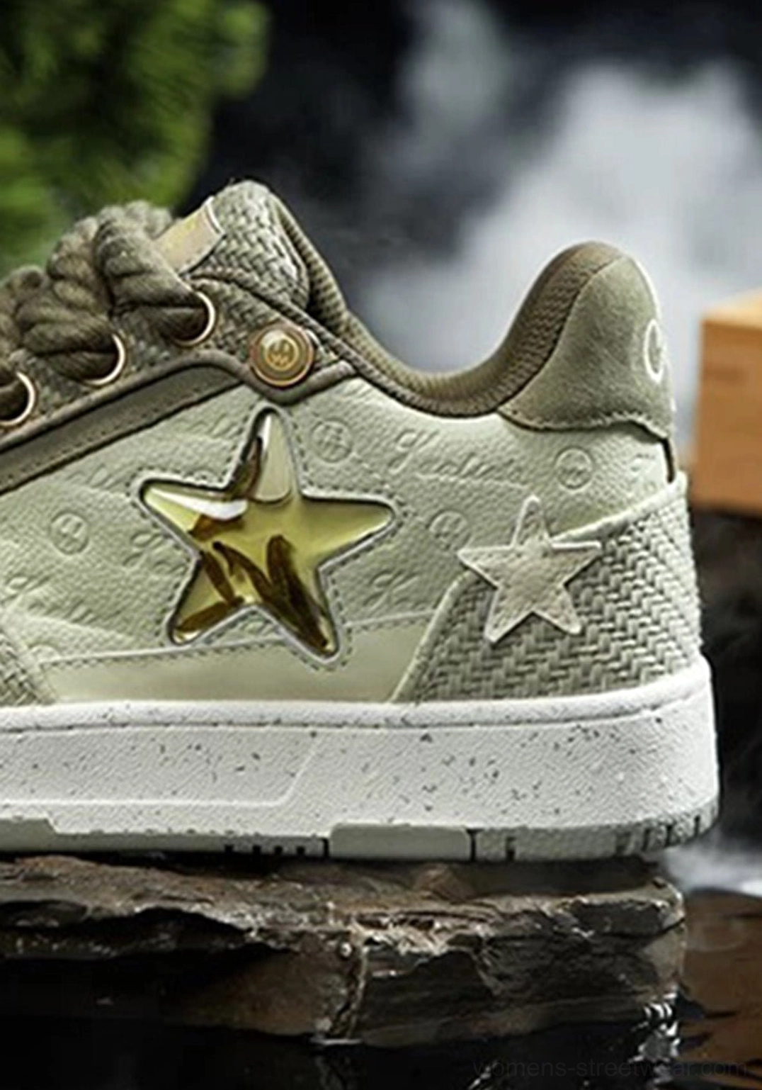 Close-up of green Longjing tea star sneakers showing embossed textures, metallic gold star decoration, woven fabric panels, and thick rope shoelaces