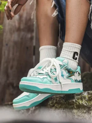 Green mint platform skate sneakers worn with white crew socks and frayed denim shorts in an outdoor-inspired streetwear setting