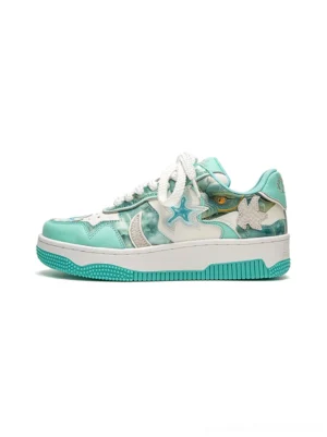 Green and mint star patch platform skate sneakers shown from the side with camo-inspired overlays, white laces, and chunky two-tone rubber soles
