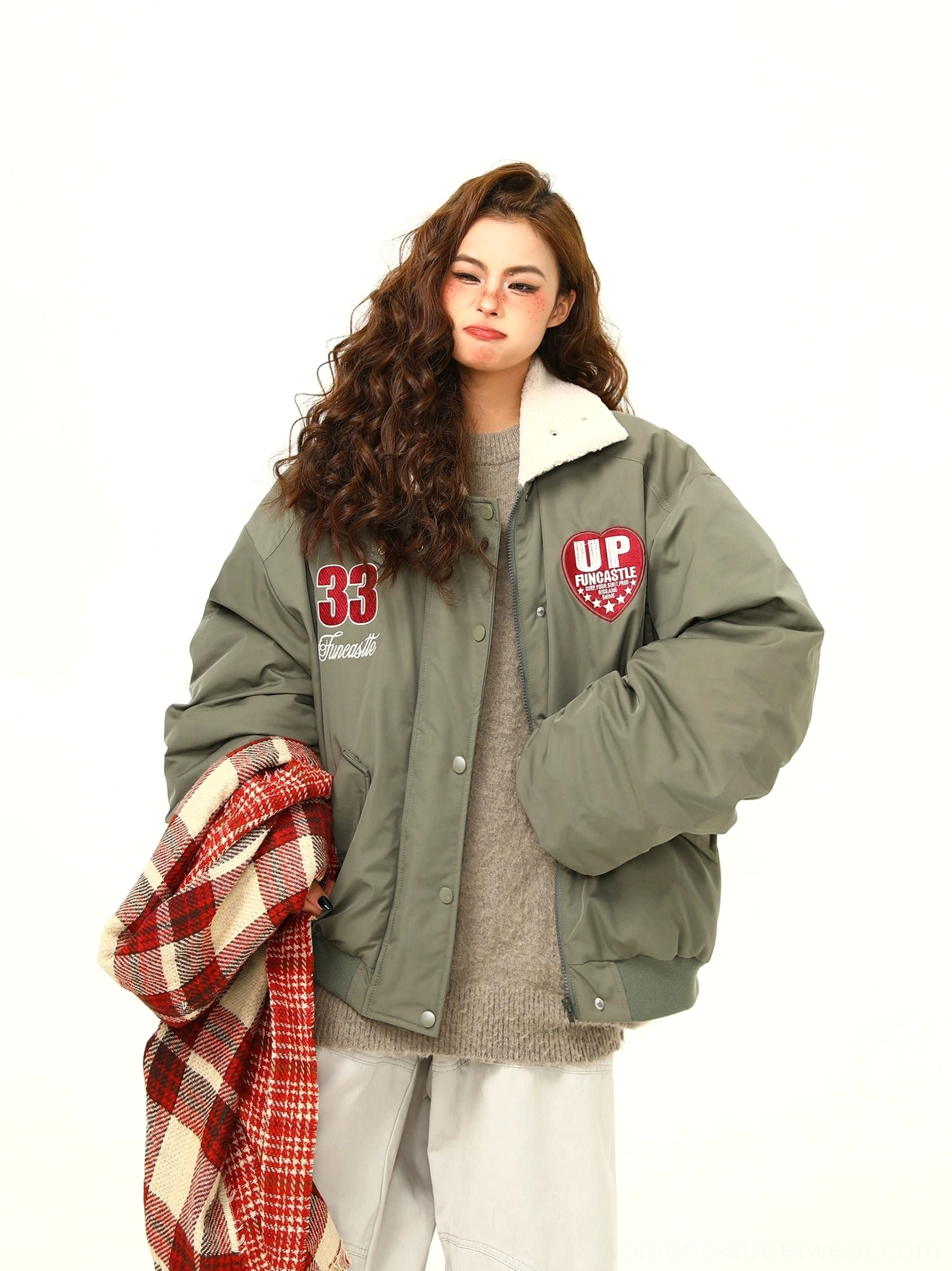 Green oversized varsity bomber jacket with fleece collar and relaxed collegiate streetwear fit