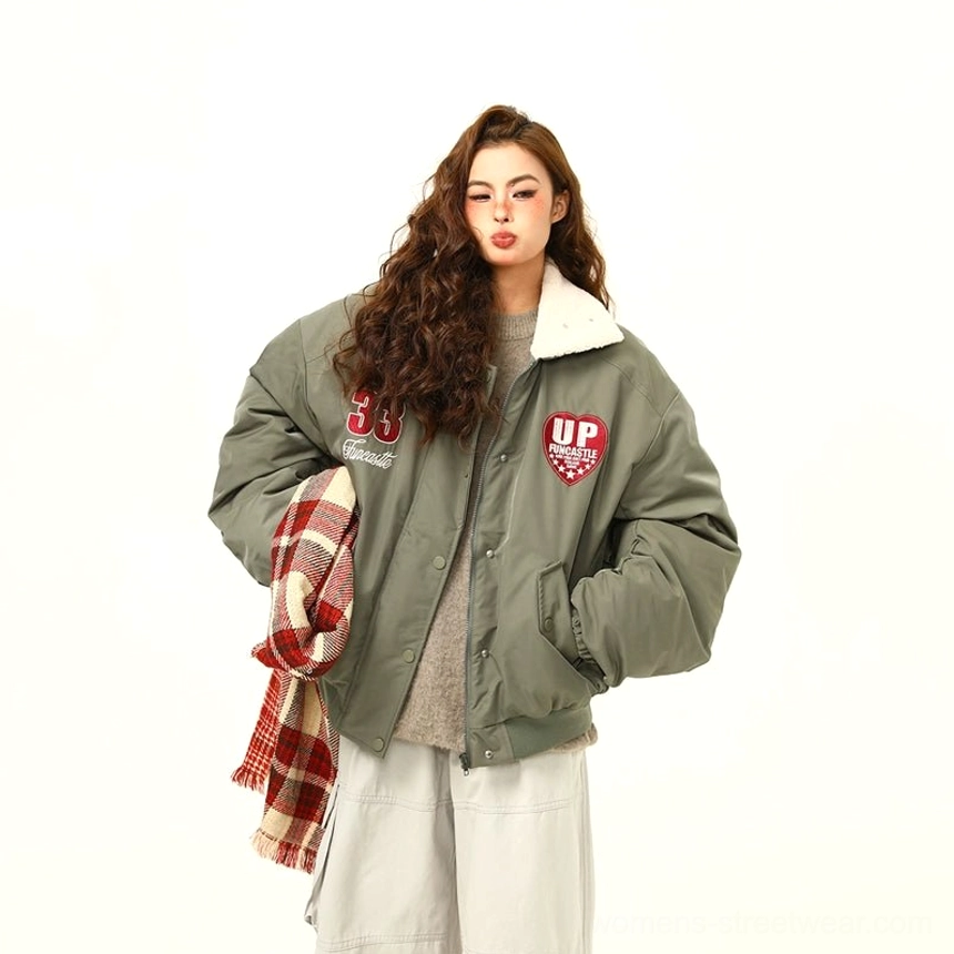 Green oversized varsity patch bomber jacket with contrast fleece collar and embroidered patches